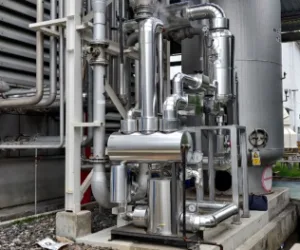 A picture showing the Forbes Marshall PPPPU Mechanical Condensate Recovery Pump installed outside a factory to recovery and pump condensate
